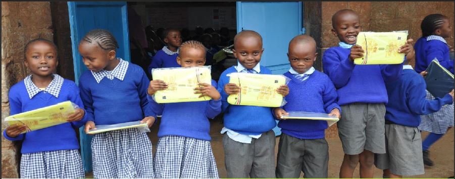school children receiving eaglegroup edutabs